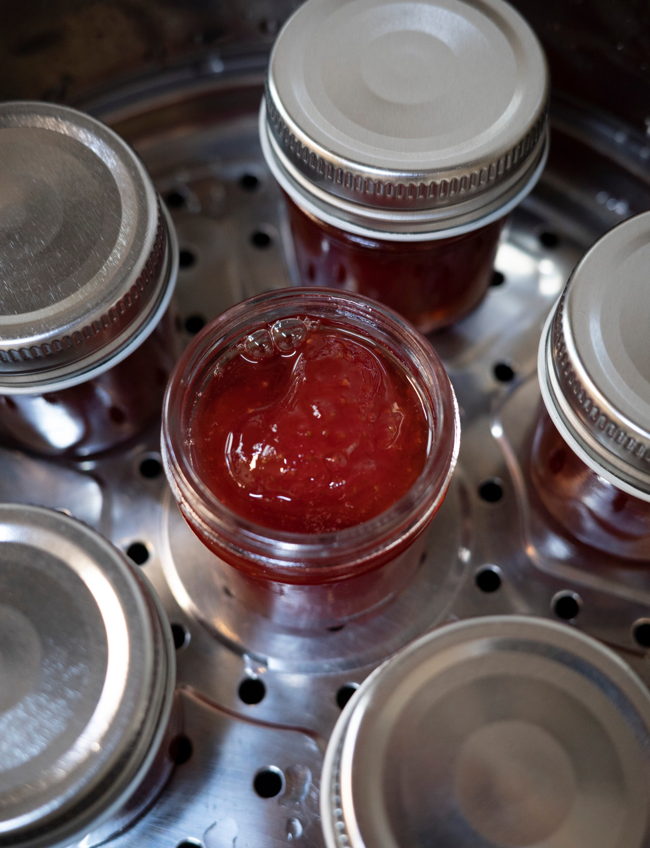 The bright red jam is exposed, quite appetizing